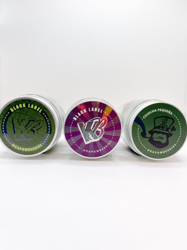 Black Label Kapowberries THCa Rosin in a glass jar with glossy, cold-cured texture