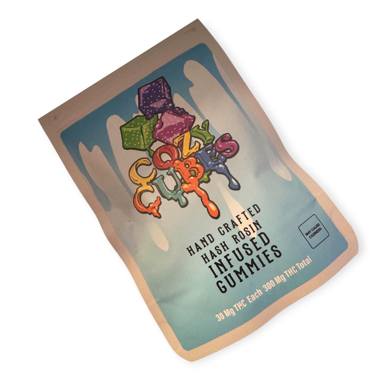 "Chocolate chip pancake-flavored THC gummies with golden syrup tones and cozy branding from Cozy Cubes x Master Ball Melts